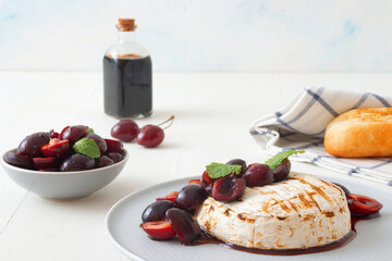 Grilled Camemberts cheese, cherries with honey and balsamic vinegar syrup