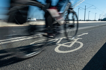 City street bicycle lane in heavy traffic with motion blur