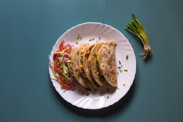Tortilla with chicken and vegetable wraps on a plate with use of selective focus 