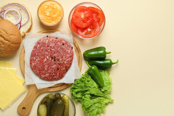 Concept of cooking burger on beige background