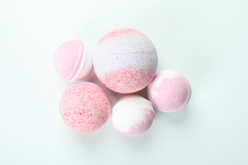 Pink bath balls on white background, close up