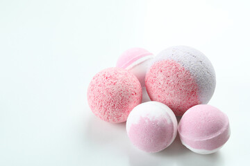 Pink bath balls on white background, space for text