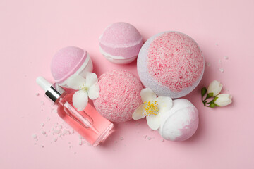 Body care concept with bath balls on pink background