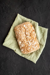 Whole grain bread on cuttin board. Top view