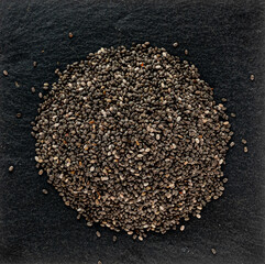 Fragrant dried black chia seeds, spices for cooking, macro photography