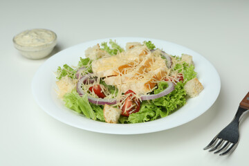 Concept of tasty eating with Caesar salad on white background