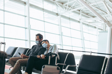 Couple waiting for delayed flight at airport
