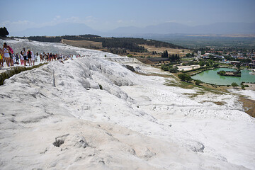 A mountainside covered with white travertine.