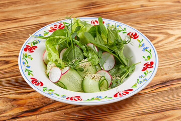 fresh salad on the wooden background