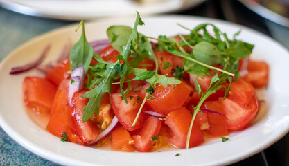 Healthy tomato salad with parsley