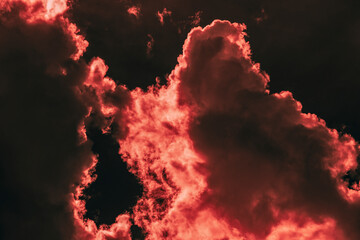 Thunderclouds at the red sunset of the day. Selective focus.