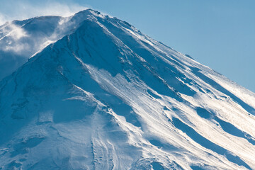 Snow covered icy peak of Mount Fuji. Japan's highest mountain and active volcano.