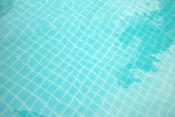 Blurred blue color of pool watercolor with a white shadow of small grid pattern in deep water for background texture 