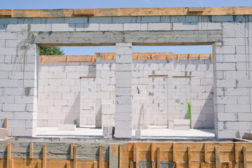 White house from aerated concrete blocks or foam blocks at a construction site. Building a house on the site