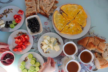 Breakfast table shot contains different types of foods. Turkish-Mediterrannean breakfast