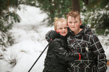 Two caucasian brothers cross country skiing at Mount Stirling, Victoria Australia posing together...