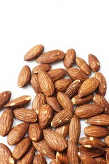 Almonds on white background. Close up. Blurry. Copy space