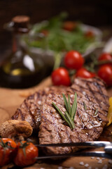 Sliced grilled medium rare beef steak served with fries