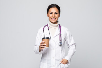 Attractive doctor woman posing in a studio in front of a background