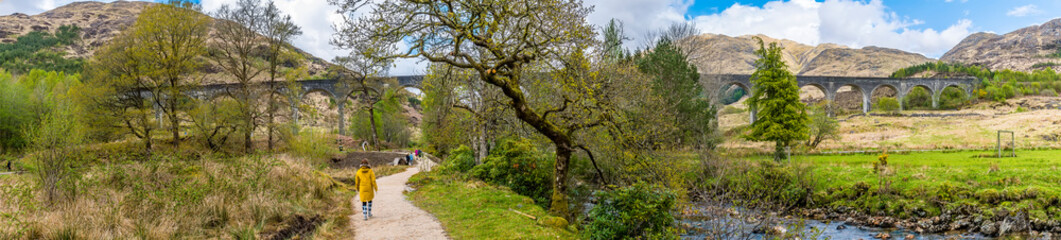 A panorama view along the path to the viaduct at Glenfinnan, Scotland on a summers day