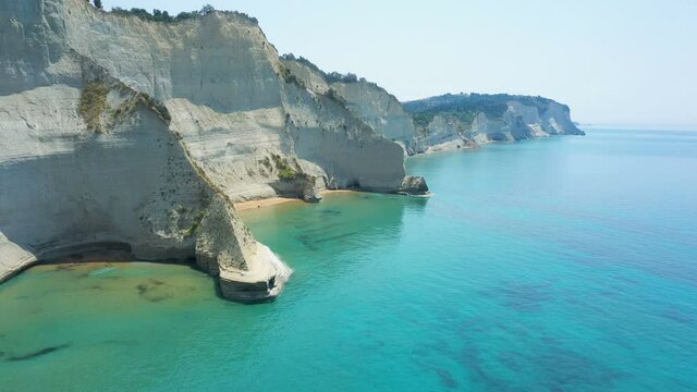 aerial view of sheer white cliffs of Cape Drastis near Peroulades village on Corfu Island in Greece
