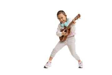 Happy Asian child girl play ukulele, isolate on white background.