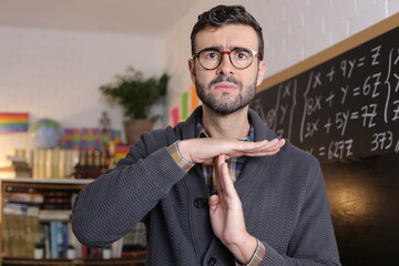 Teacher asking for a break with time-out hand gesture