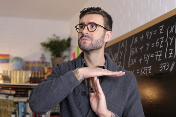 Teacher asking for a break with time-out hand gesture