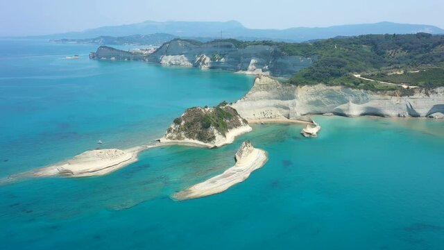 aerial view of sheer white cliffs of Cape Drastis near Peroulades village on Corfu Island in Greece
