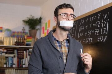 Censored teacher with tape blocking freedom of speech