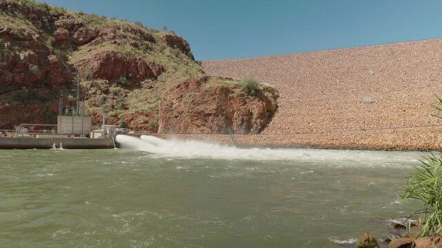 a low angle view of lake argyle power station outlet near kununurra in western australia