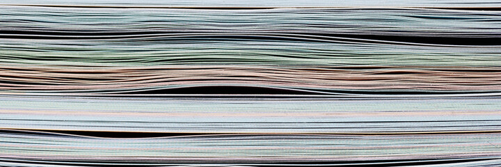 Stack of colored papers in archive closeup background