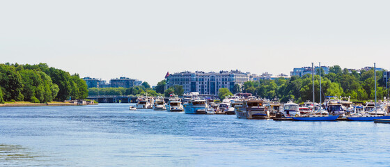 Fototapeta na wymiar Panoramic summer cityscape, yacht club in the Krestovsky Island and residential areas in Saint Petersburg, Russia