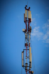 Mobile towers during the day against the blue sky