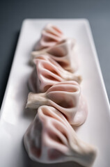 georgian dumplings with meat or sweet strawberry khinkali on black background