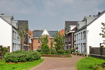 Oegstgeest, The Netherlands, July 11, 2021: recently built brick houses in traditional style grouped around a courtyard