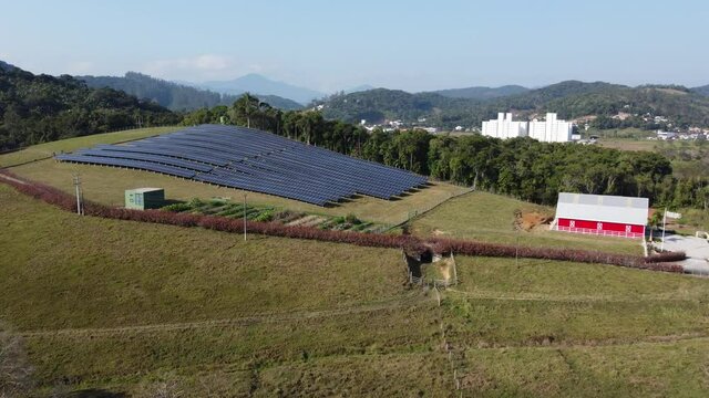 Aerial View of Solar Panels on a Ecological Farm. Electrical innovation nature environment