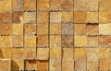 Texture surface material, calibrated wooden coniferous timber ends in stack for construction