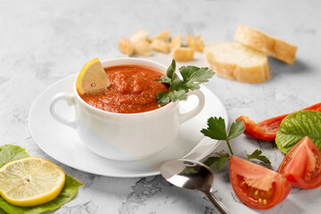 tomato soup with basil in bowl