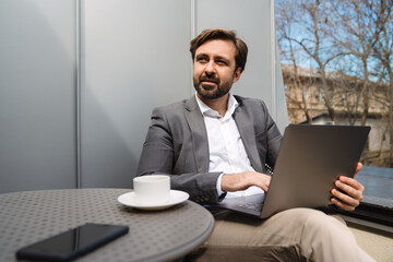 Smiling mid aged bearded businessman