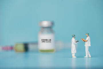 Miniature support team, Doctor and Nurse emergency medical team wear surgical mask consultant with assistants on blue sky background. Health care, life insurance for covid-19 concept.