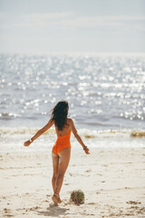 Fototapeta premium Woman in Swimsuit with Watermelon on the Beach Outdoors