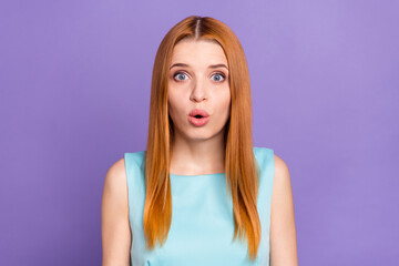 Photo of amazed shocked nice young redhead woman reaction face news isolated on violet color background