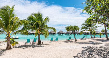 Luxury travel resort at white tropical beach of French Polynesia, Society Islands.