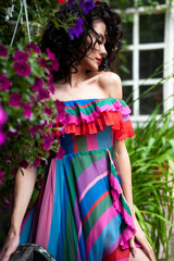 Beautiful sensual woman portrait outdoor in flowers dress