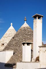 Beautiful town of Alberobello with typical trulli houses built from stone, main touristic district, Apulia region, Southern Italy, UNESCO World Heritage Site