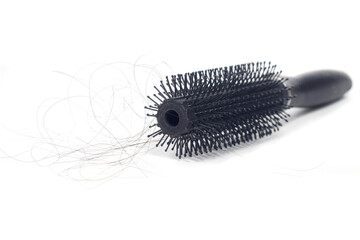 Photo Hair fall at white Black plastick comb, White Background