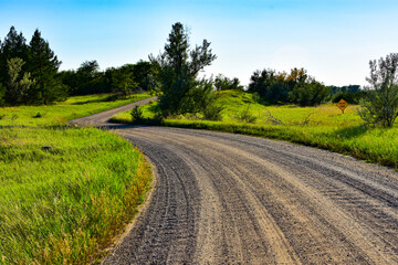 Gravel roads will take you on a relaxing journey away from the congestion  into the wide open spaces such as this one in North Dakota.