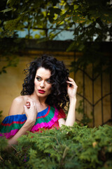 Woman wearing flowers dress in hot summer city