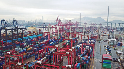 HONG KONG. February 20. Aerial view of huge industrial port with containers and huge ship.